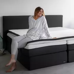 Koop een matrastopper om het bed zachter te maken